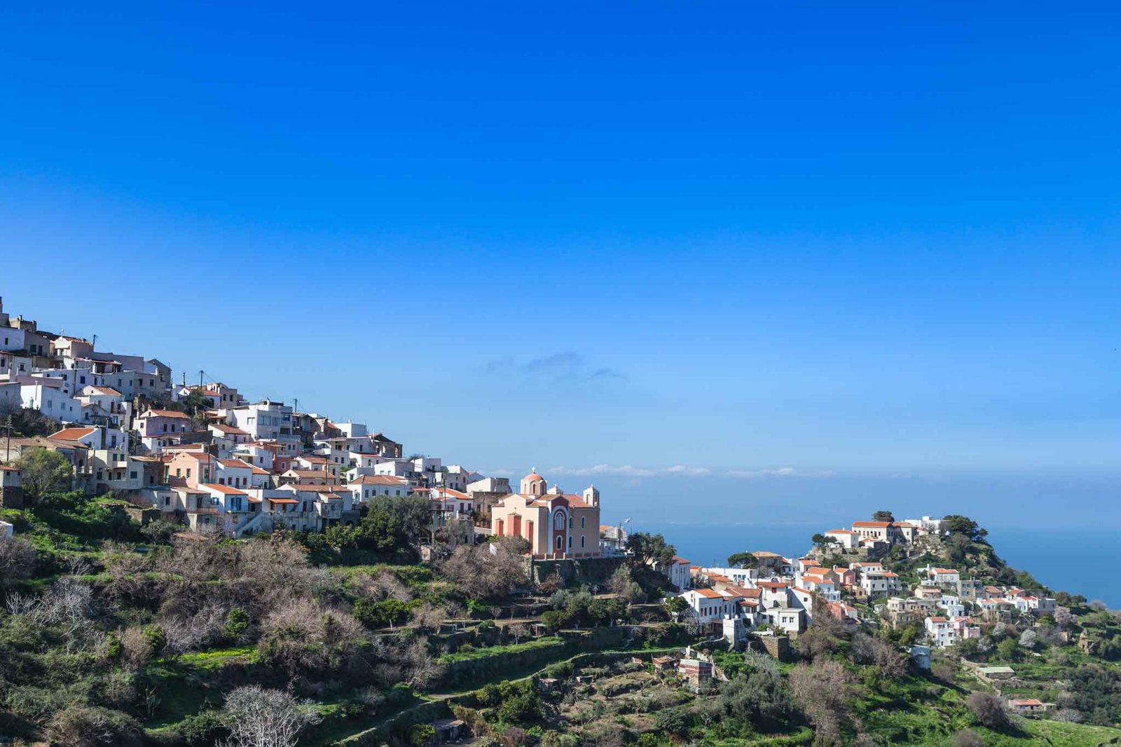 Scenic view over hills and sea of Kea island
